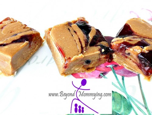 This super-simple peanut butter jelly fudge recipe makes a great treat at Christmas-time... Or anytime!