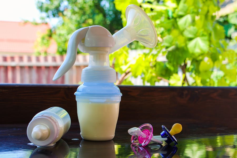 World Breast Pumping Day concept image of pump and baby items