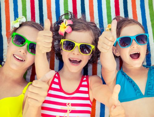 Three kids at the beach on march break