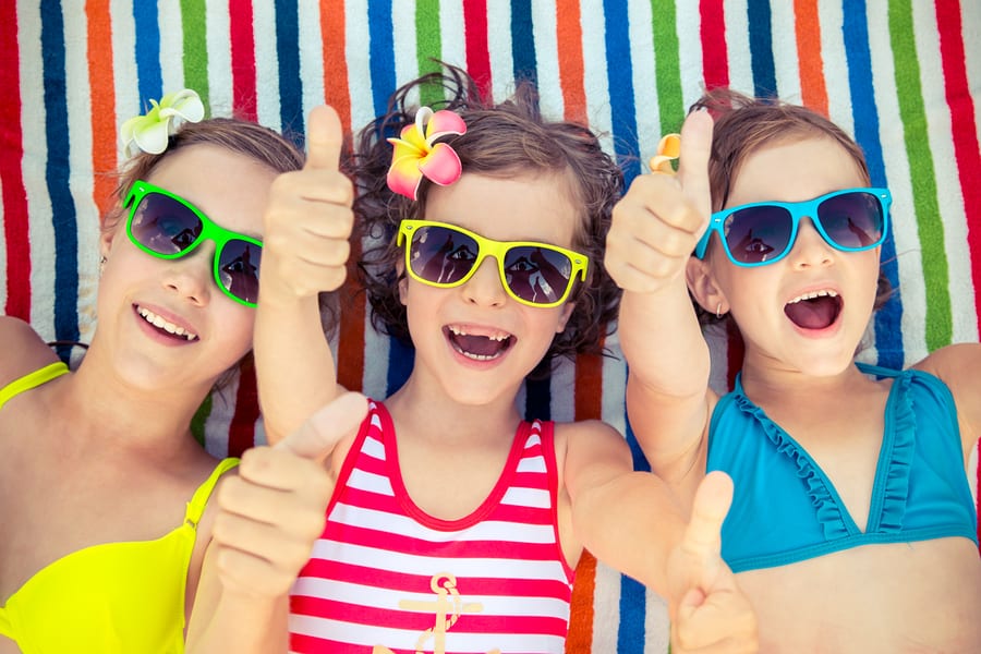 Three kids at the beach on march break