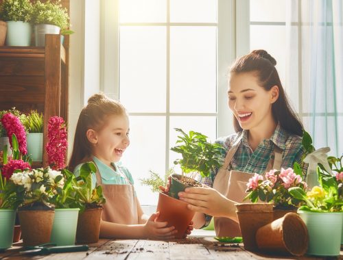 Mom and daughter gardening in the spring