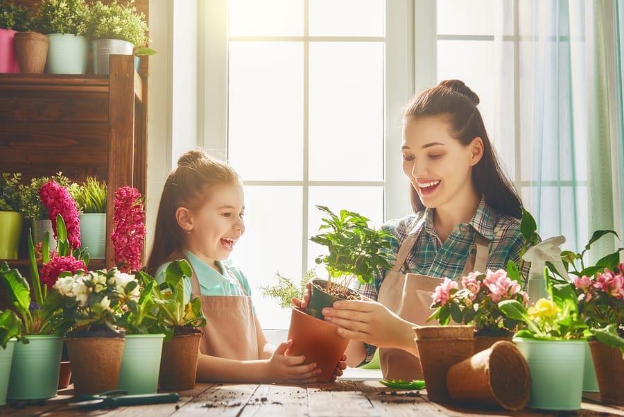 Mom and daughter gardening in the spring